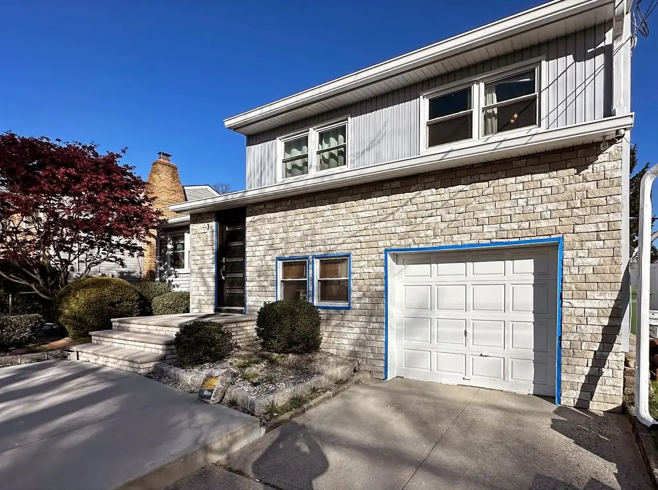 Completed stone veneer facade by JP Wall Worthy Construction